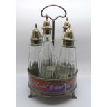 A George III five bottle cruet on a plated stand