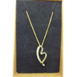 A 9ct gold and diamond pendant on a 9ct gold chain, 2.1g