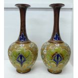 A pair of Royal Doulton Slater's Patent stoneware vases with long flared necks, 40cm
