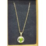 A 9ct gold, peridot and diamond pendant on a 9ct gold chain, 2.2g