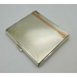 A hallmarked silver Art Deco cigarette case with applied gold decoration, William Neale,