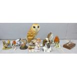 A collection of animal figures including an owl and a Royal Doulton squirrel and two Goebel owls **