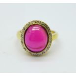 A silver gilt and synthetic cabochon ruby ring, O