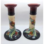 A pair of Moorcroft Tulip candlesticks, 21cm