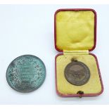 Two medallions; Colonial and Indian Exhibition London 1886 and Royal Life Saving Society, boxed