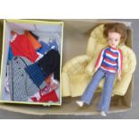 A 1960's Sindy doll with clothes and a sofa set