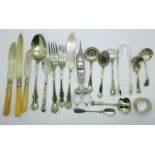 A pair of plated candle snuffers, servers and other flatware