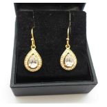 A pair of silver gilt and diamond simulant drop earrings