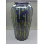 Anita Harris Studio Pottery, contemporary trial vase with a green design on a deep blue ground,
