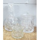 A glass decanter, preserve pot and biscuit barrel