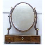 A George III bow fronted mahogany toilet mirror with ivory embellishments