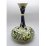 A Moorcroft Juneberry vase, designed by Angela Davenport, signed on the base, 24cm, boxed