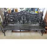 A large black painted cast iron bench