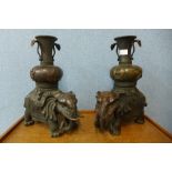 A pair of Chinese bronze elephant vases, 42cms h