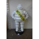 A cast iron Michelin Man figure