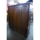 A Victorian pine sliding two door cupboard