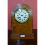 A 19th Century inlaid walnut lancet shaped mantel clock, the movement signed A.D. Mougin
