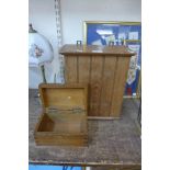 An oak hanging cabinet and one other