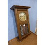 A WML Gilbert Winsted oak wall clock