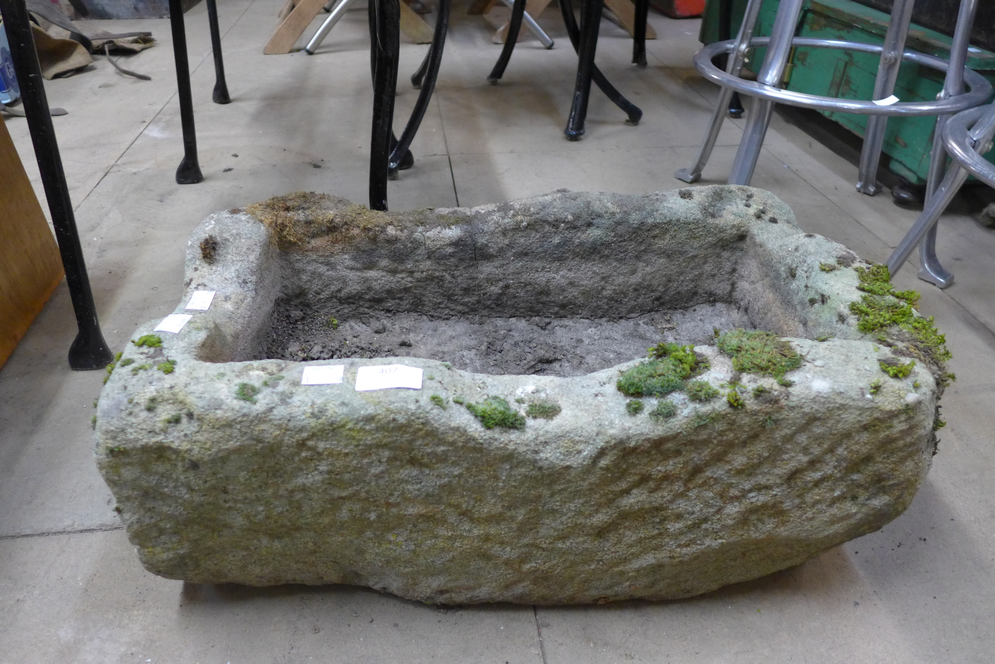 A reconstituted stone garden trough