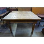 An oak draw-leaf table