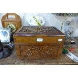 A carved hardwood table top box