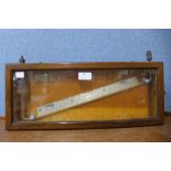 A cased Negretti & Zambra water level gauge