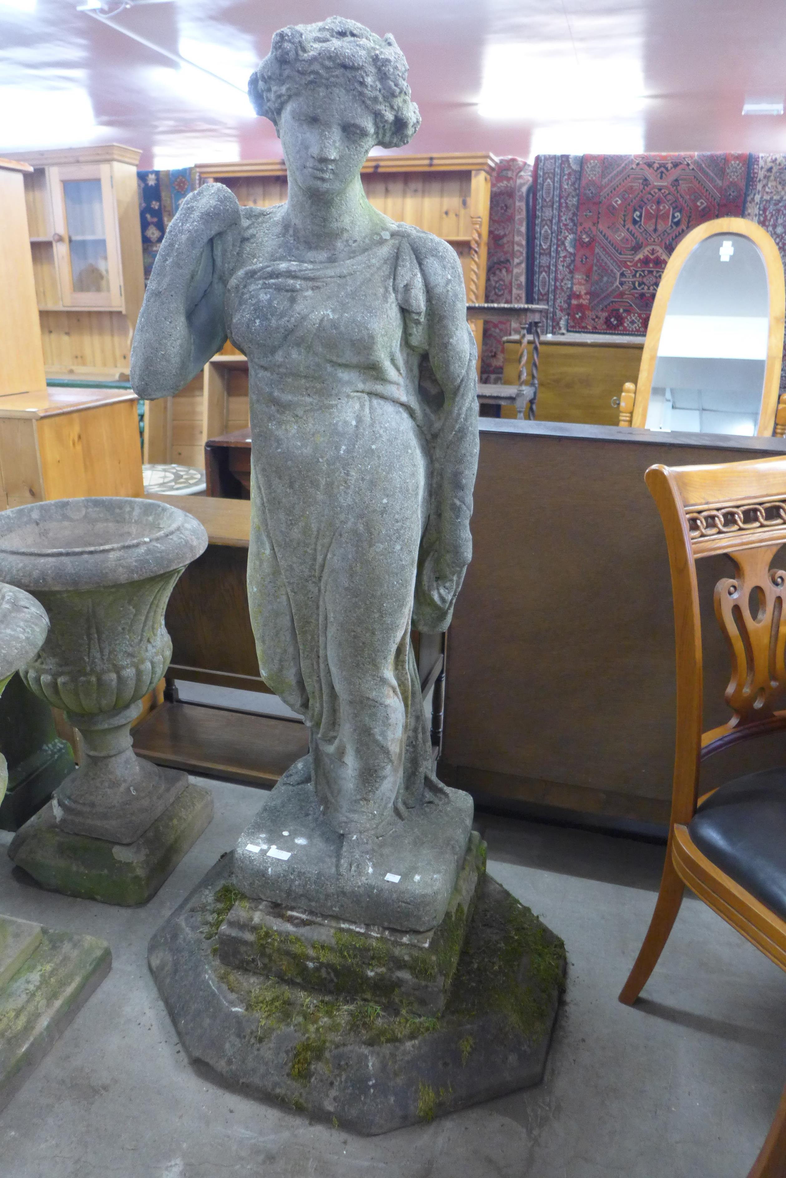 A large concrete garden figure of Venus