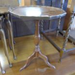 A mahogany tripod wine table