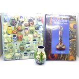 A small Moorcroft vase and two Moorcroft books