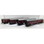 Four OO gauge model railway carriages including Hornby