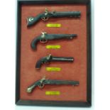 A novelty display of four miniature Italian pistols