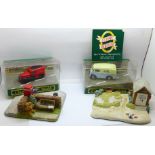 Two Corgi Classic model die-cast vehicles with two The Classic Heritage stands