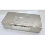 A heavy silver cigarette box with engine turned duck decoration, Birmingham 1947, by A. Wilcox,