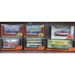 Six Exclusive First Editions model vehicles including buses, boxed