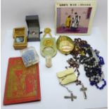 A collection of religious items including nine rosaries, an onyx and gilt metal Holy water font, a