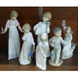 One Lladro and five Nao by Lladro figurines of children at bedtime. ?Girl Kissing (goodnight)? (