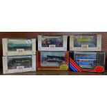 Six Exclusive First Editions model vehicles including four OO scale lorries and buses, boxed