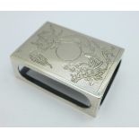 An oriental white metal matchbox cover decorated with a dragon, with control marks