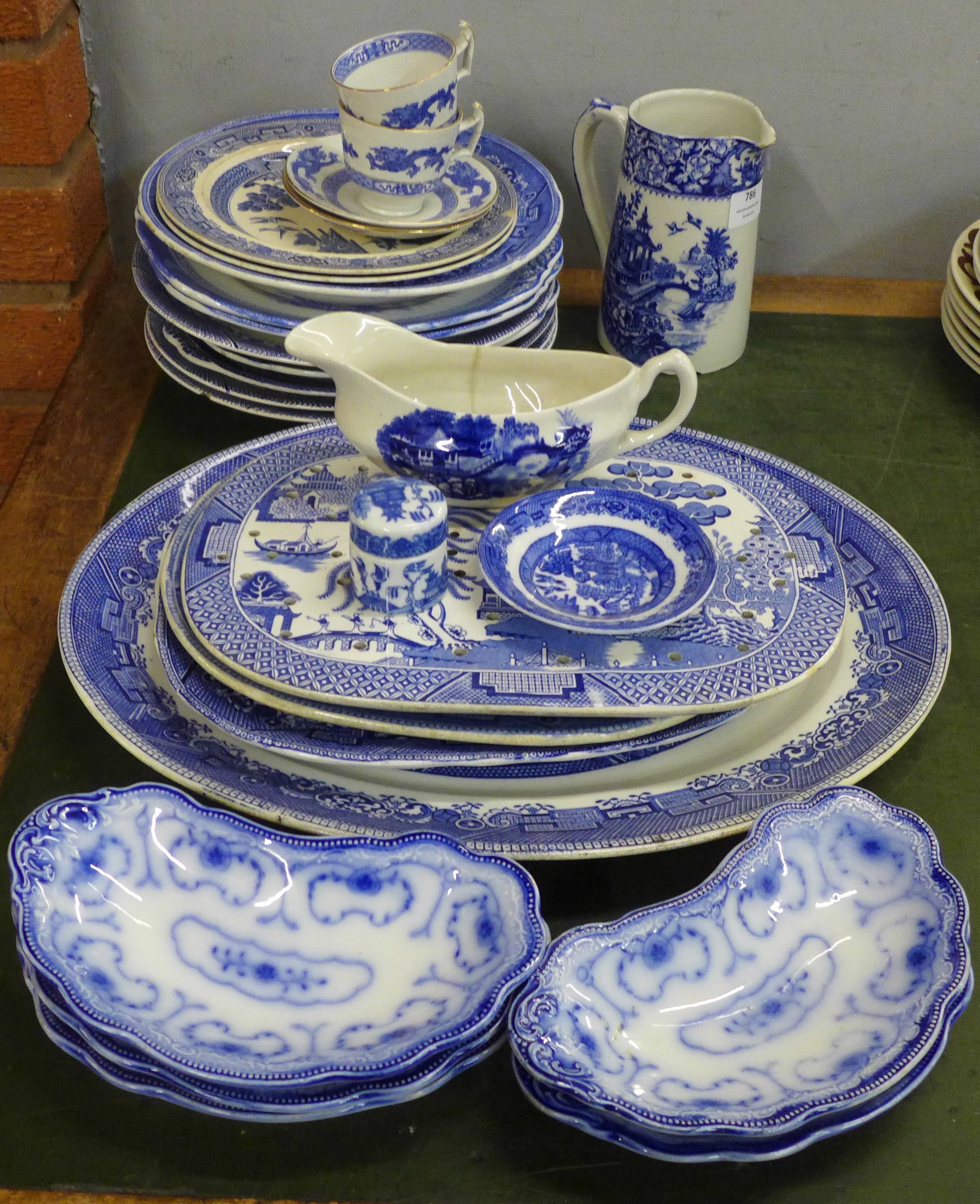 Assorted blue and white china, mainly Willow pattern, twenty-five pieces