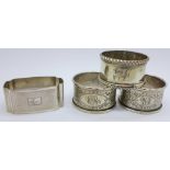 Four silver napkin rings, including a pair by Walker & Hall, 89g