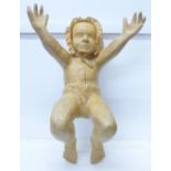 A carved child Nativity sculpture, signed AEW, 46cm, a/f