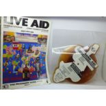 A Live Aid 1985 programme and a Band Aid picture disc 1984