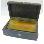 A French Bakelite music box, Ile Ste Helene Habitation de Napoleon scene on the lid, bottom of