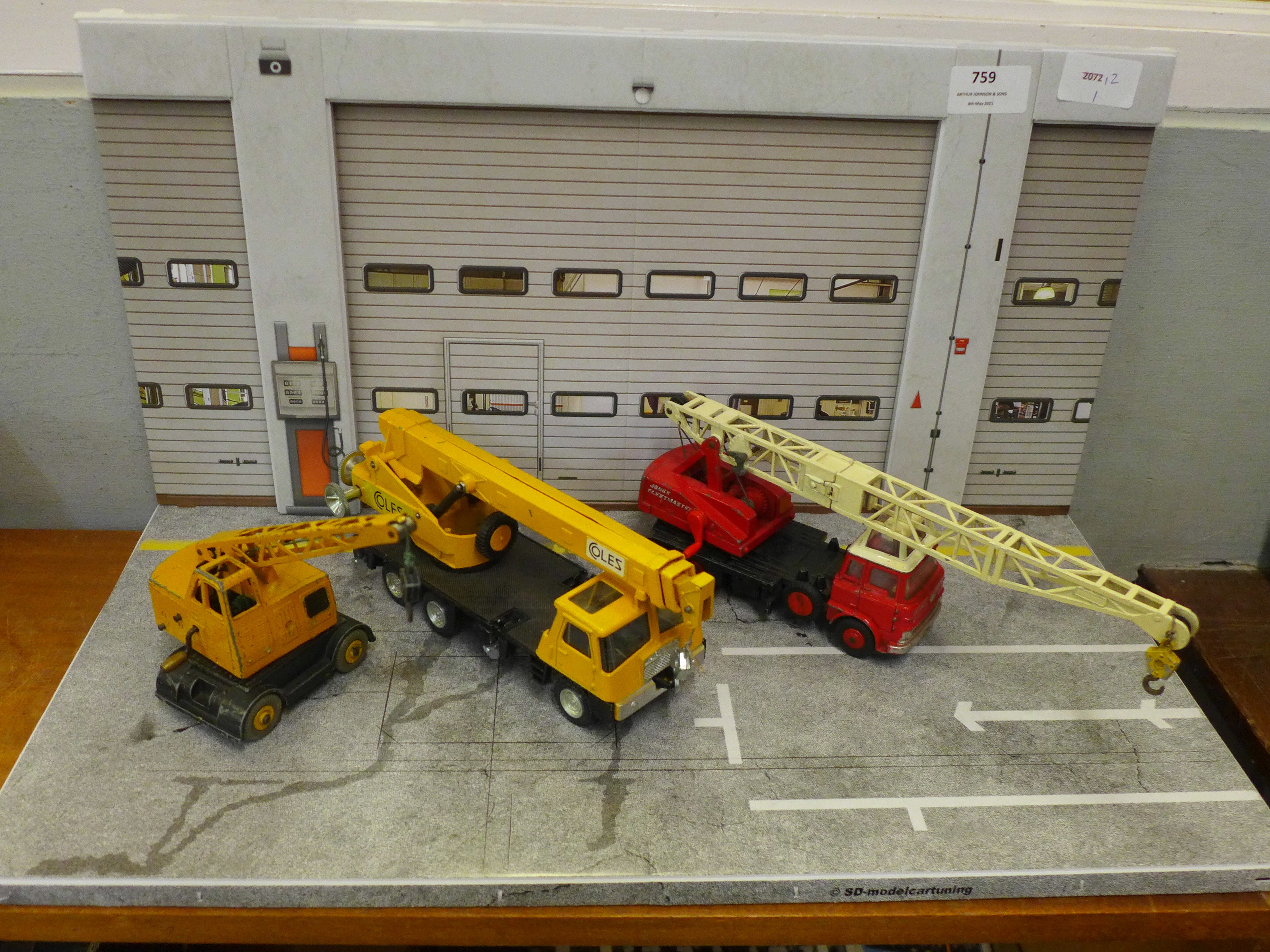 Three Dinky Toys model cranes diorama, comprising Jones Fleetmaster, Coles Hydra Truck and Coles