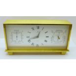 A Looping Electric desk clock, thermometer and barometer combination, with a box marked Boodle &