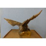 A carved oak figure of an eagle