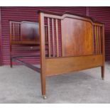A Edward VII inlaid mahogany double bed