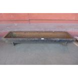 A cast iron feeding trough