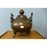 A large oriental bronze two handled koro and cover